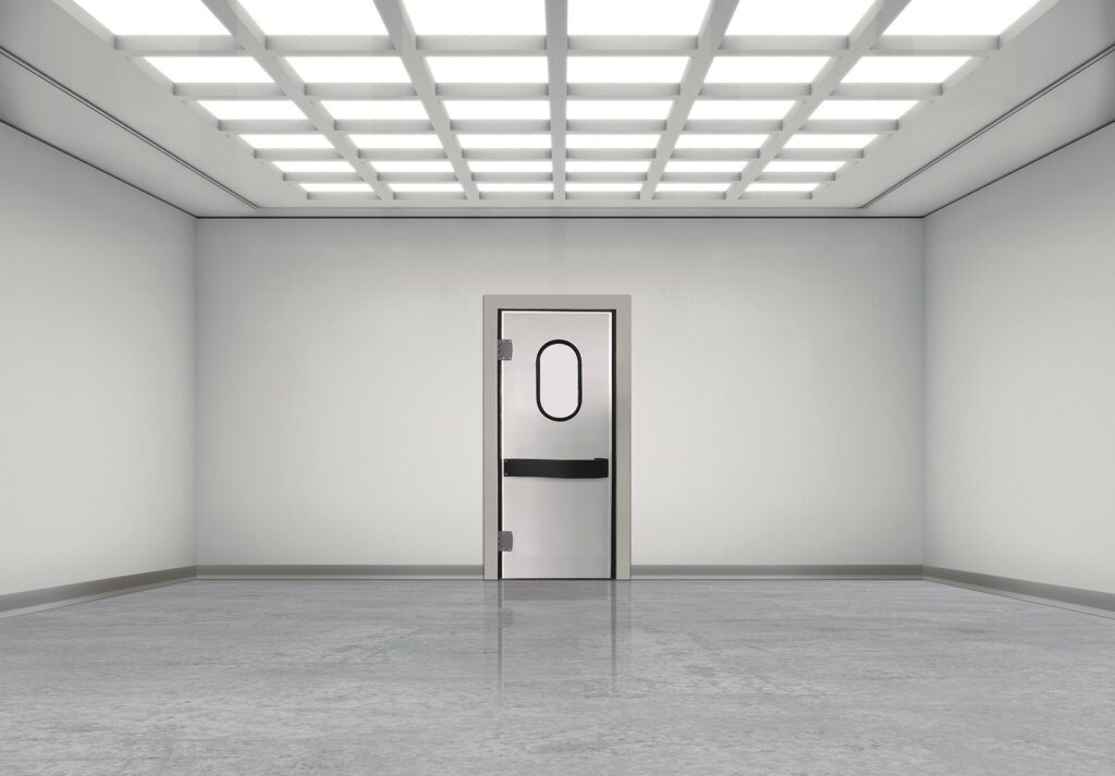 Empty white room with glossy floor, grid lights, and a metal door with oval window