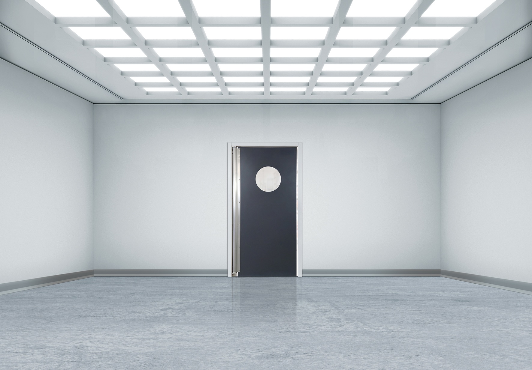 Minimalist white room with grid lights and a black door with circular window.