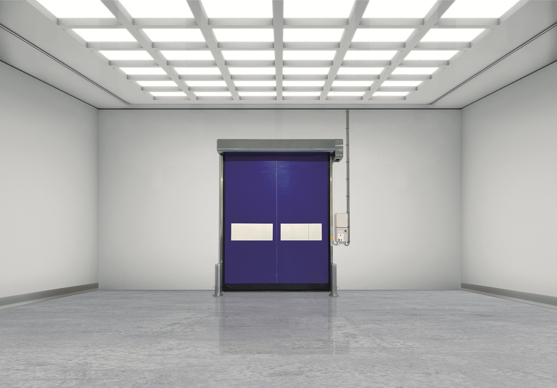 Blue high-speed roll-up door in a bright, empty cleanroom.